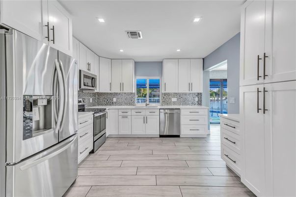 Interior, Kitchen, Recessed Lighting, Stainless Steel Appliances, Wood Texture Flooring