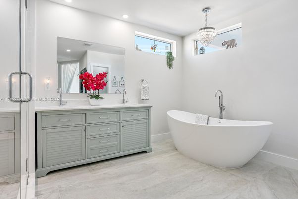 Bathroom, Chandelier, Dual Sink Vanities, Free Standing Baths, Interior, Marble, Pendant Lights, Recessed Lighting