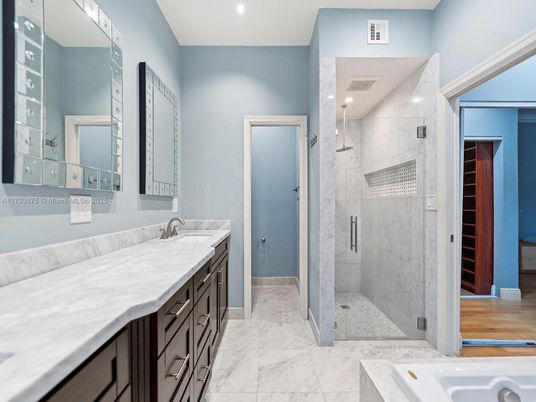 Bathroom, Dual Sink Vanities, Glass Shower, Interior, Marble, Marble Walls, Recessed Lighting