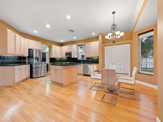 Chandelier, Dining room, Interior, Kitchen, Recessed Lighting, Stainless Steel Appliances, Wood Texture Flooring