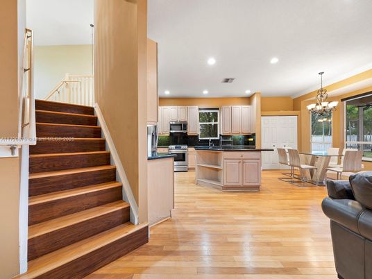 Chandelier, Dining room, Interior, Kitchen, Pendant Lights, Recessed Lighting, Stainless Steel Appliances, Wood Texture Flooring