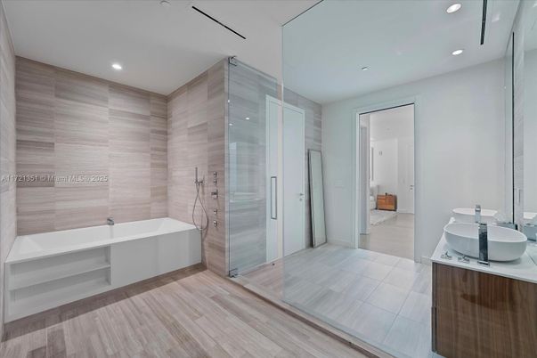 Bathroom, Dual Sink Vanities, Glass Shower, Interior, Recessed Lighting, Wood Texture Flooring