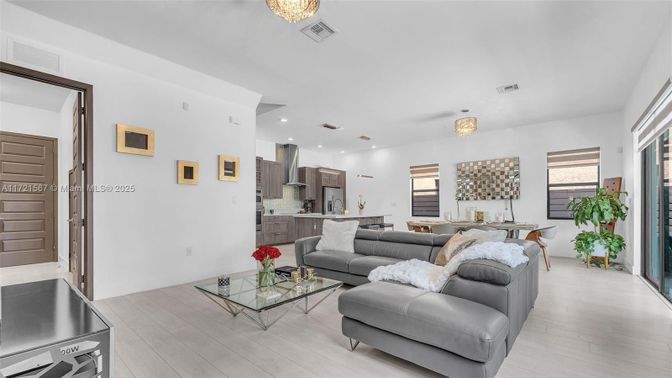 Chandelier, Dining room, Interior, Kitchen, Living room, Recessed Lighting, Stainless Steel Appliances, Wood Texture Flooring