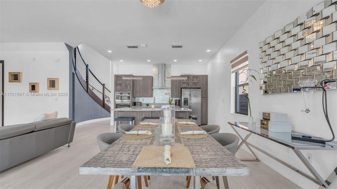 Dining room, Interior, Kitchen, Pendant Lights, Recessed Lighting, Stainless Steel Appliances, Wood Texture Flooring