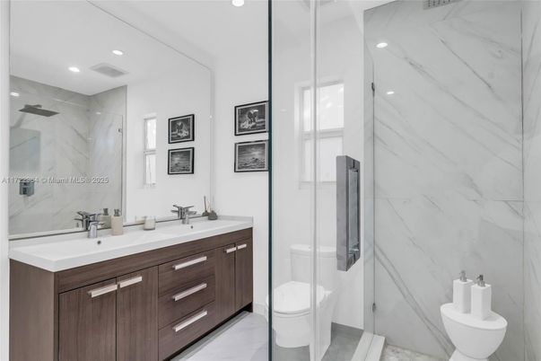 Bathroom, Dual Sink Vanities, Glass Shower, Interior, Marble, Marble Walls, Recessed Lighting