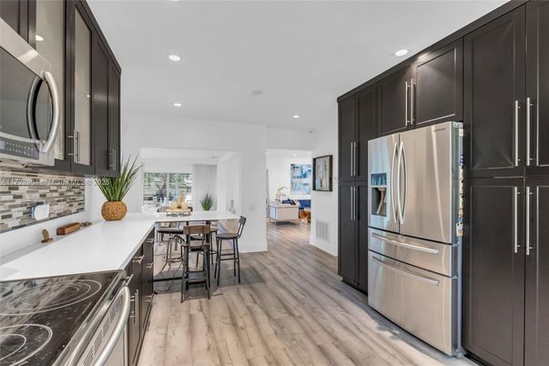 Interior, Kitchen, Recessed Lighting, Stainless Steel Appliances, Wood Texture Flooring