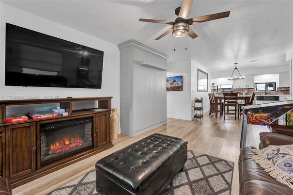Dining room, Fireplace, Interior, Kitchen, Living room, Pendant Lights, Wood Texture Flooring