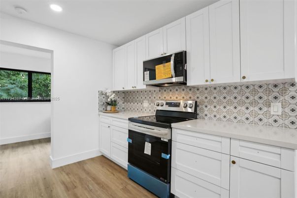 Interior, Kitchen, Recessed Lighting, Stainless Steel Appliances, Wood Texture Flooring