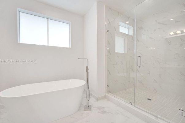 Bathroom, Free Standing Baths, Glass Shower, Interior, Marble, Marble Walls, Recessed Lighting