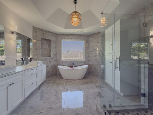 Bathroom, Dual Sink Vanities, Free Standing Baths, Glass Shower, Interior, Marble, Marble Walls, Pendant Lights