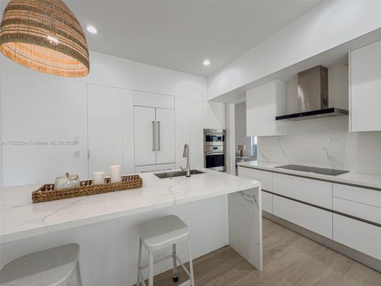 Interior, Kitchen, Marble Walls, Recessed Lighting, Stainless Steel Appliances, Wood Texture Flooring