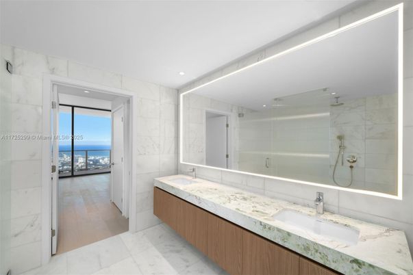 Bathroom, Dual Sink Vanities, Glass Shower, Interior, Marble, Marble Walls, Recessed Lighting, Water