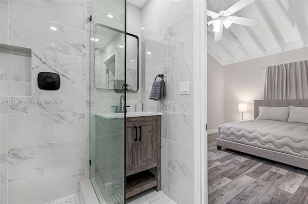 Bathroom, Bedroom, Glass Shower, Interior, Marble Walls, Recessed Lighting, Wood Texture Flooring