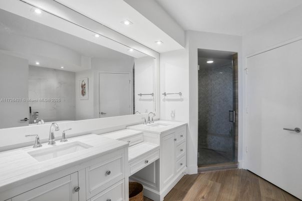 Bathroom, Dual Sink Vanities, Glass Shower, Interior, Recessed Lighting, Wood Texture Flooring