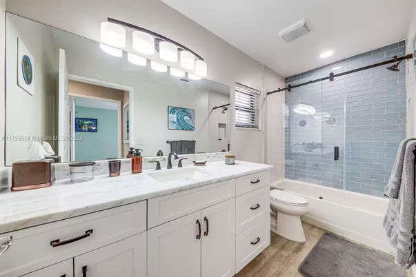 Bathroom, Dual Sink Vanities, Glass Shower, Interior, Recessed Lighting, Wood Texture Flooring