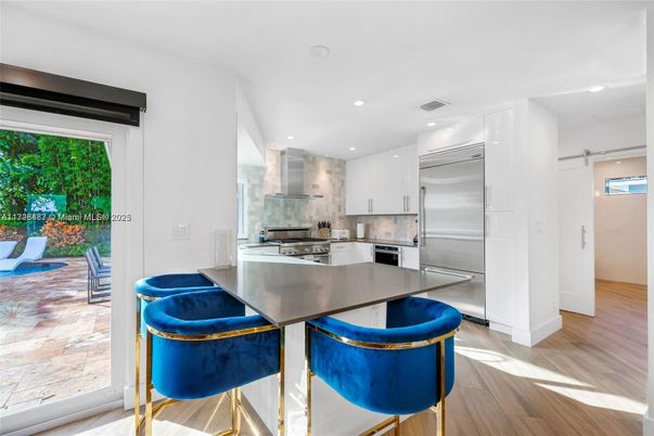 Dining room, Interior, Kitchen, Recessed Lighting, Stainless Steel Appliances, Wood Texture Flooring