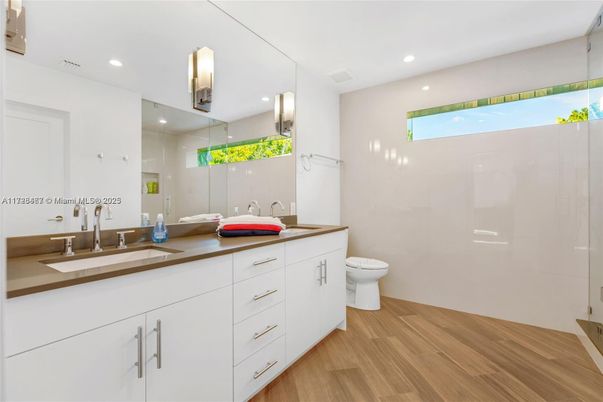 Bathroom, Dual Sink Vanities, Interior, Recessed Lighting, Wood Texture Flooring