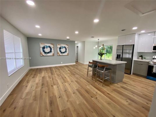 Dining room, Interior, Kitchen, Pendant Lights, Recessed Lighting, Stainless Steel Appliances, Wood Texture Flooring