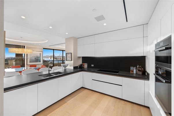 Chandelier, Dining room, Interior, Kitchen, Recessed Lighting, Stainless Steel Appliances, Wood Texture Flooring