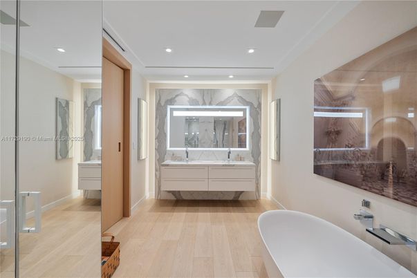 Bathroom, Free Standing Baths, Interior, Marble Walls, Recessed Lighting, Wood Texture Flooring