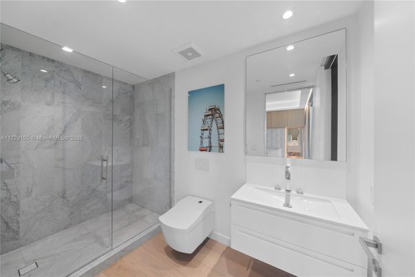 Bathroom, Glass Shower, Interior, Marble Walls, Recessed Lighting, Wood Texture Flooring