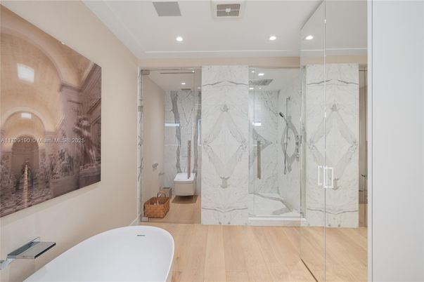Bathroom, Free Standing Baths, Glass Shower, Interior, Marble Walls, Recessed Lighting, Wood Texture Flooring