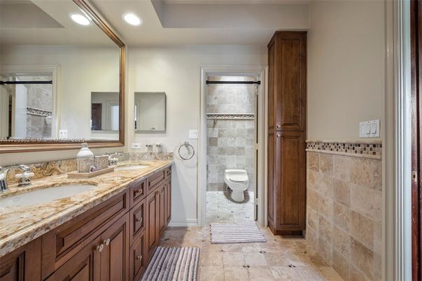 Bathroom, Dual Sink Vanities, Interior, Recessed Lighting, Stone Walls