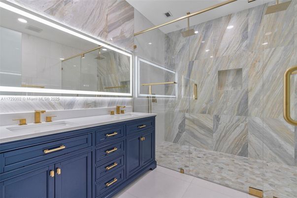 Bathroom, Dual Sink Vanities, Glass Shower, Interior, Marble Walls, Recessed Lighting