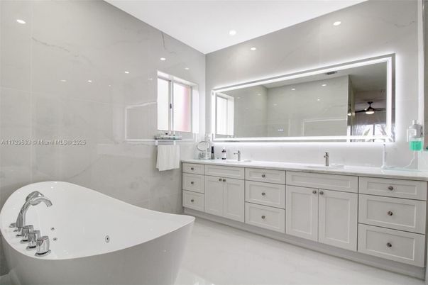 Bathroom, Dual Sink Vanities, Free Standing Baths, Interior, Marble, Marble Walls, Recessed Lighting