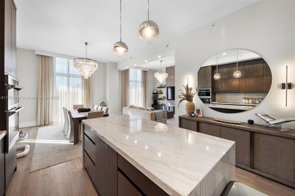 Chandelier, Dining room, Interior, Kitchen, Living room, Pendant Lights, Recessed Lighting, Stainless Steel Appliances, Wood Texture Flooring