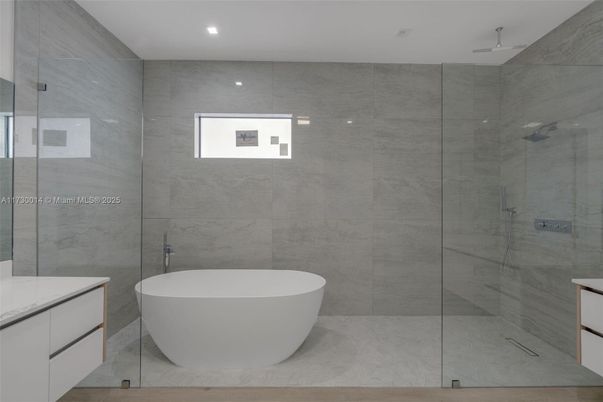 Bathroom, Free Standing Baths, Glass Shower, Interior, Marble Walls, Recessed Lighting