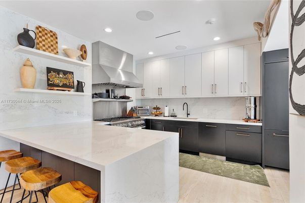 Interior, Kitchen, Marble Walls, Recessed Lighting, Stainless Steel Appliances, Wood Texture Flooring