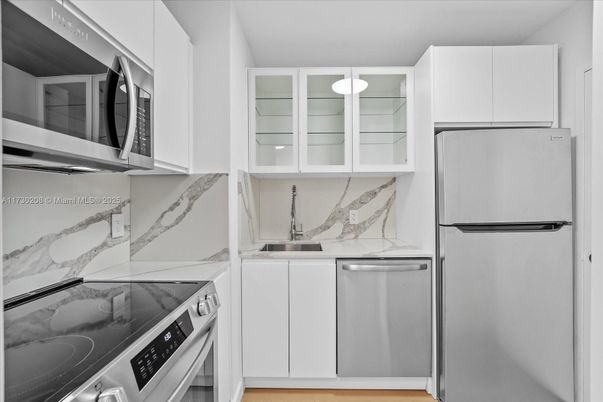Interior, Kitchen, Marble Walls, Stainless Steel Appliances, Wood Texture Flooring