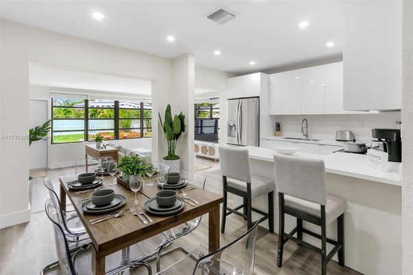 Dining room, Interior, Kitchen, Recessed Lighting, Stainless Steel Appliances, Wood Texture Flooring