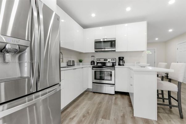 Interior, Kitchen, Recessed Lighting, Stainless Steel Appliances, Wood Texture Flooring