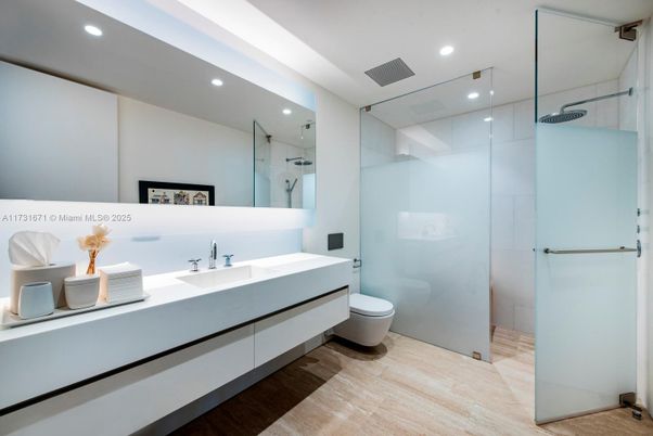 Bathroom, Dual Sink Vanities, Glass Shower, Interior, Recessed Lighting, Wood Texture Flooring