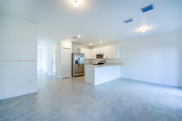 Empty room, Interior, Kitchen, Recessed Lighting, Stainless Steel Appliances