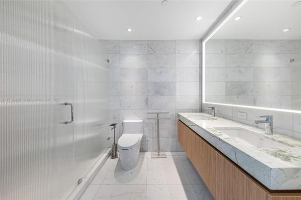 Bathroom, Dual Sink Vanities, Glass Shower, Interior, Marble, Marble Walls, Recessed Lighting