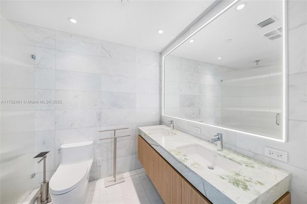 Bathroom, Dual Sink Vanities, Glass Shower, Interior, Marble Walls, Recessed Lighting