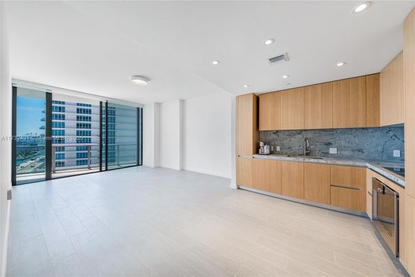 Interior, Kitchen, Marble Walls, Recessed Lighting, Water, Wood Texture Flooring
