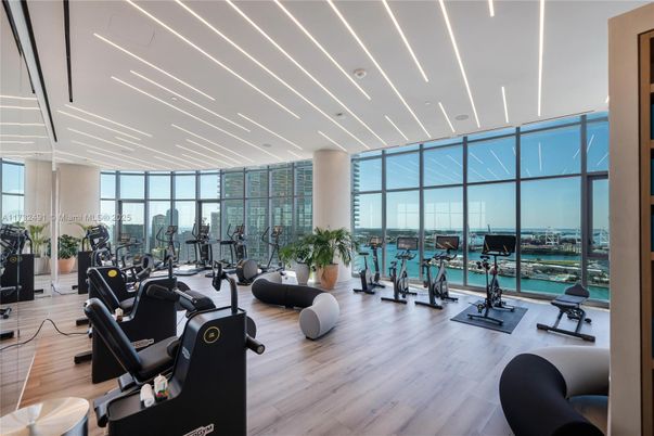 Fitness Equipment, Gym, Interior, Recessed Lighting, Water, Wood Texture Flooring
