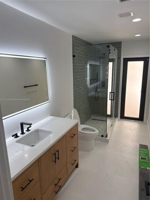 Bathroom, Dual Sink Vanities, Glass Shower, Interior, Recessed Lighting, Stone Walls
