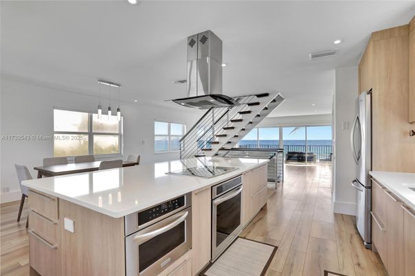 Dining room, Interior, Kitchen, Pendant Lights, Recessed Lighting, Stainless Steel Appliances, Wood Texture Flooring