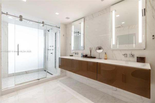 Bathroom, Dual Sink Vanities, Glass Shower, Interior, Marble, Marble Walls, Recessed Lighting