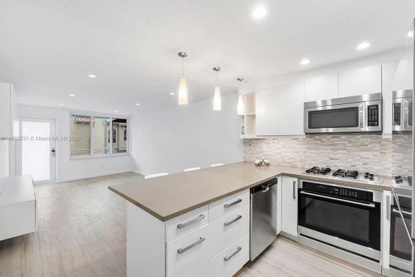 Interior, Kitchen, Pendant Lights, Recessed Lighting, Stainless Steel Appliances, Wood Texture Flooring