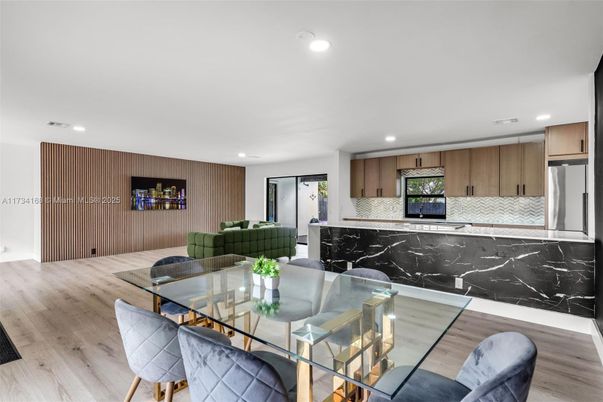 Dining room, Interior, Kitchen, Living room, Marble Walls, Recessed Lighting, Stainless Steel Appliances, Wood Texture Flooring