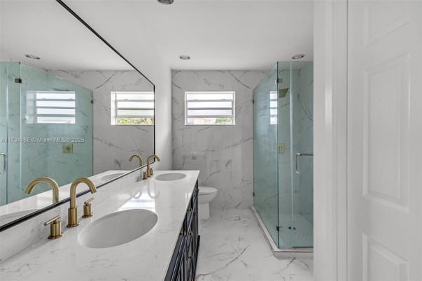 Bathroom, Dual Sink Vanities, Glass Shower, Interior, Marble, Marble Walls, Recessed Lighting