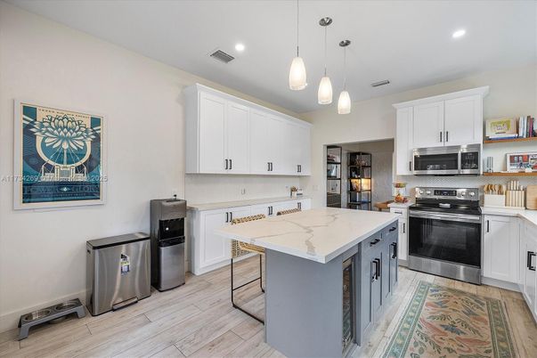 Interior, Kitchen, Pendant Lights, Recessed Lighting, Stainless Steel Appliances, Wood Texture Flooring