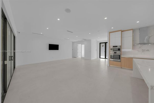 Empty room, Interior, Kitchen, Marble Walls, Recessed Lighting, Stainless Steel Appliances