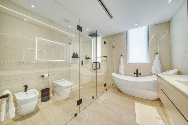 Bathroom, Free Standing Baths, Glass Shower, Interior, Recessed Lighting, Wood Texture Flooring